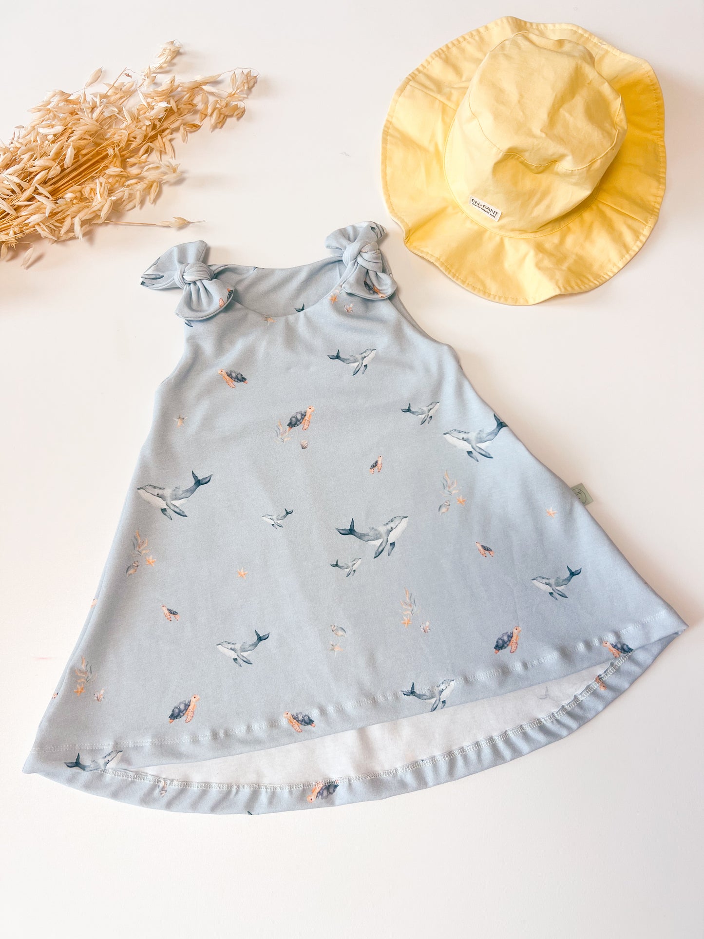 Mädchenkleid mit Schleife und Zipfelsaum, Wal